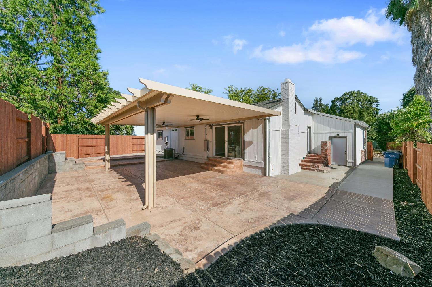 Covered outdoor living area beside the completed Fair Oaks ADU